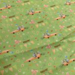 Percal estampado infantil con conejos fondo arena